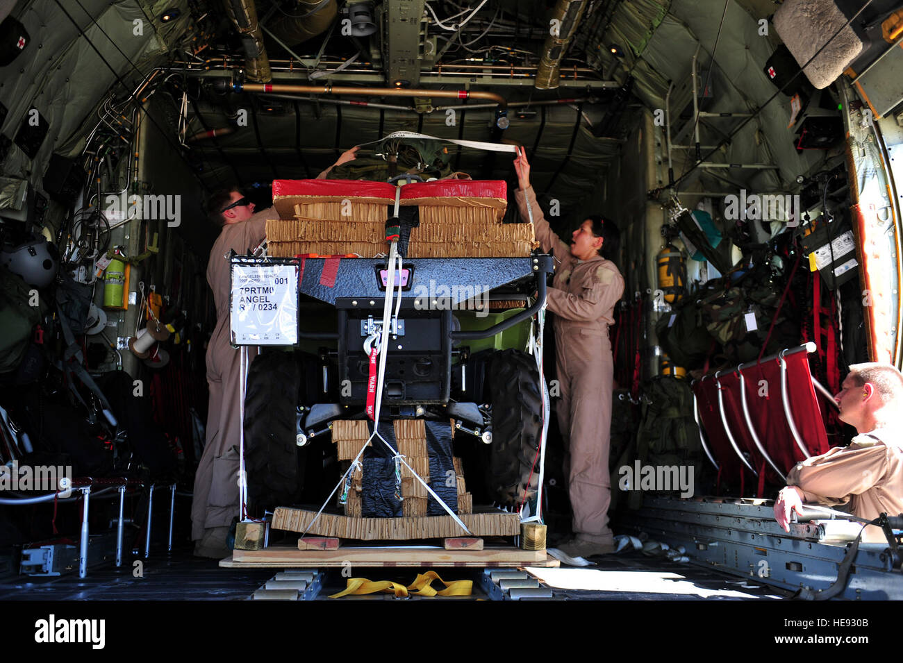 Air Force personnel from the 211th Rescue Squadron, Alaska ANG, load ...