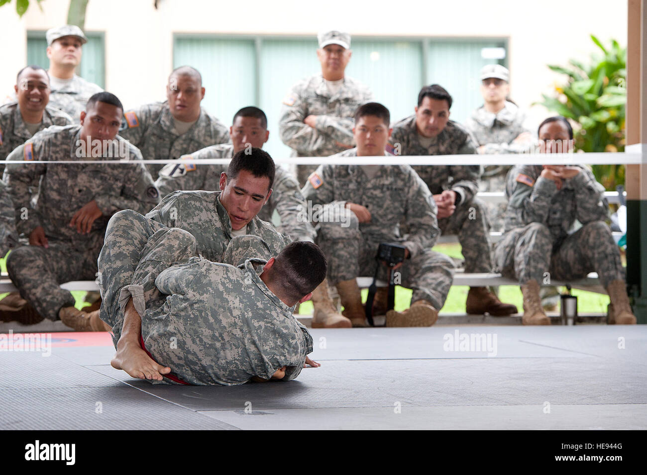 U.S. Army soldiers, Army National Guard, Hawaii, compete during the combatives portion of the Best Warrior Competition March 2, 2014, at Marine Corps Training Area Bellows, Hawaii. Modern Army Combatives is a close quarters combatives system designed to allow a soldier to close with the enemy and destroy them.  Staff Sgt. Christopher Hubenthal) Stock Photo