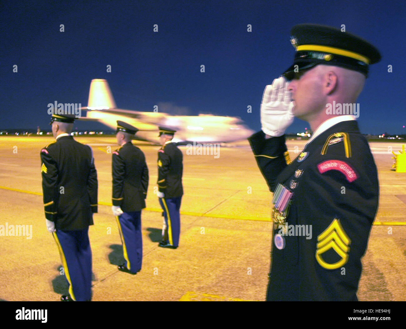 At Yokota Air Base, US Army Honor Guard salute the arrival of a C130