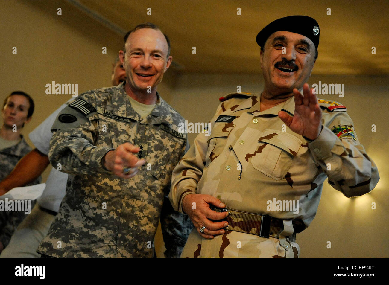 U.S. Army Lt. Gen. Charles Jacoby, Commander of Multi-National Corps - Iraq, and Gen. Ali Ghaidan, Commander of Iraqi ground forces, talk with media during an awards ceremony at Forward Operating Base Diamondback in Mosul, Iraq, Aug. 4. Jacoby's visit recognizes the continuing partnership between Iraqi security forces and coalition forces throughout northern Iraq. Stock Photo