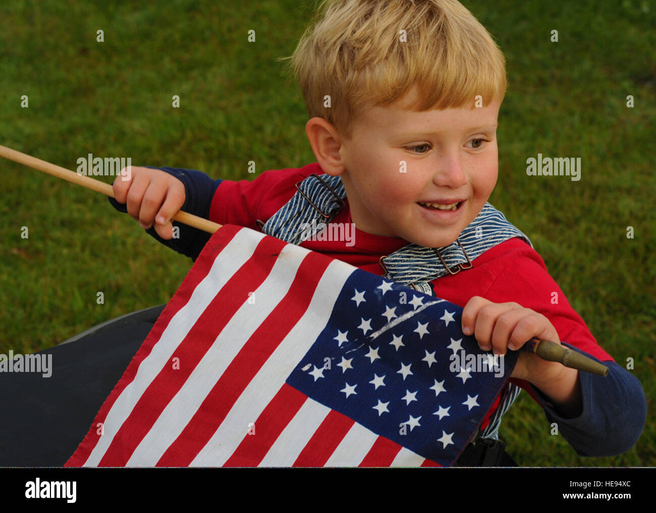 A 5yearold boy watches U.S. special tactics Airmen pass by him during