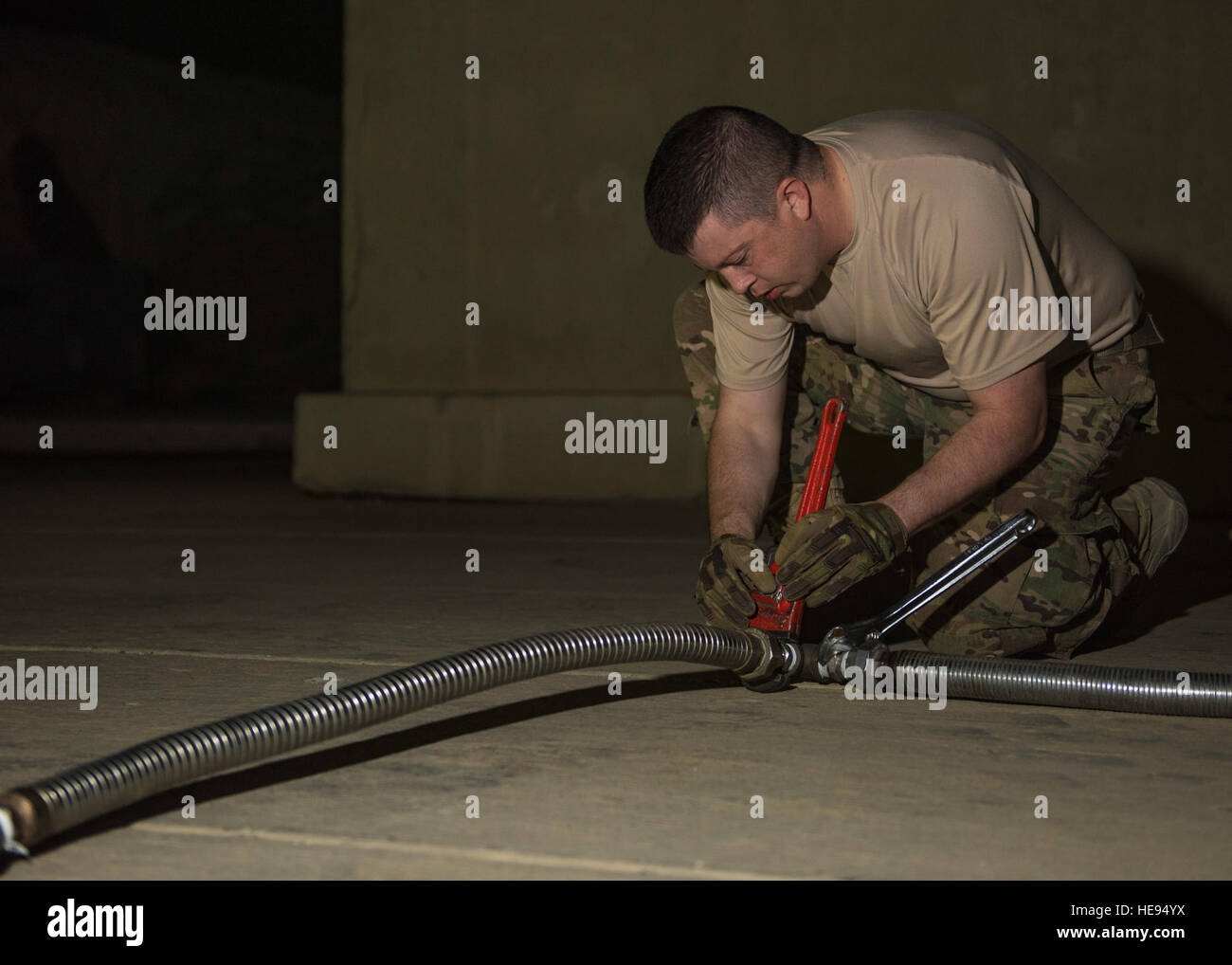 Staff Sgt. Nathan Knight, 455th Expeditionary Logistics Readiness Squadron cryogenics supervisor, adjusts a liquid oxygen tank hose, Bagram Airfield, Afghanistan, Sept. 14, 2016. The liquid oxygen tanks are supplied through the 379th ELRS at Al Udeid Air Base, Qatar. Once the oxygen is restored back into aircraft, the tanks are reconstructed and send back to Al Udeid for refill and reuse. Senior Airman Justyn M. Freeman) Stock Photo