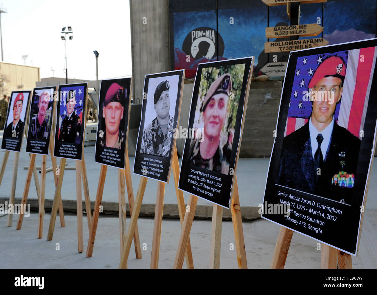 (From right to left) Posters of U.S. Air Force Senior Airman Jason Cunningham, U.S. Army Cpl. Matthew Commons, U.S. Army Spc. Marc Anderson, U.S. Army Sgt. Phillip Svitak, U.S. Army Sgt. Bradley Crose, U.S. Navy Petty Officer 1st Class Neil Roberts and U.S. Air Force Tech. Sgt. John Chapman, special operators killed during Operation Anaconda March 4, 2002, are displayed in preparation for a remembrance ceremony March 3, 2015 at Bagram Air Field, Afghanistan. Service members from all branches conducted a 24-hour vigil run and a retreat ceremony to honor the 13th anniversary of their deaths and  Stock Photo