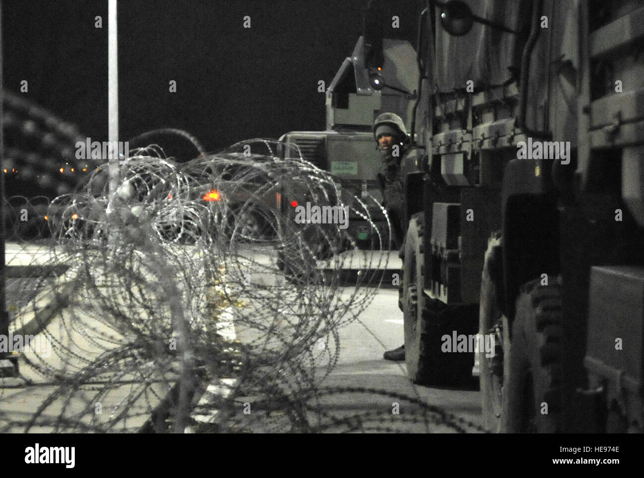 A 51st Security Forces Squadron airman takes a look around the corner
