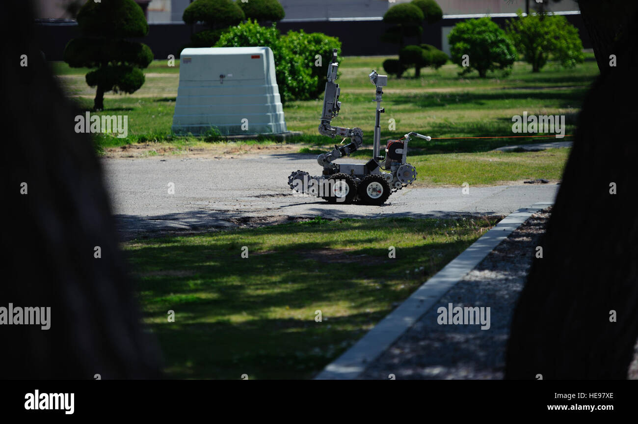An Explosive Ordnance Disposal robot rolls on scene to a suspicious package exercise at Kunsan Air Base, Republic of Korea, May 6, 2014. The EOD robot supports the wings mission by allowing Airmen to get close to suspicious objects without risking a life. The wing inspection team kept constant injects rolling in, keeping Airmen’s readiness razor sharp.  Senior Airman Armando A. Schwier-Morales Stock Photo