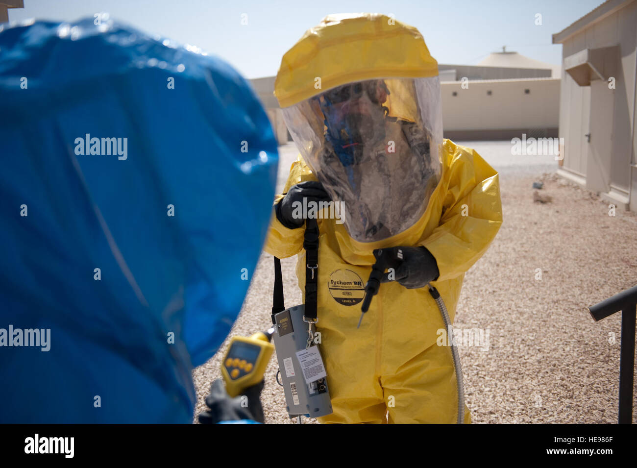 Left, U.S. Air Force Tech. Sgt. Jeremy Roberts and Senior Airman John Matlock, both with the 379th Expeditionary Medical Group Bio-environmental engineer flight, conduct a site survey to determine the presence of chemical agents during a training scenario, Oct. 2, in Southwest Asia. The 379 EMDG BEEs provide timely and accurate; health risk assessments, CBRN response, and workplace safety. Sergeant Roberts is deployed from Wright-Patterson Air Force Base, Ohio, and Airman Matlock is deployed from Lackland Air Force Base, Texas, in support of Operations Iraqi and Enduring Freedom. Stock Photo