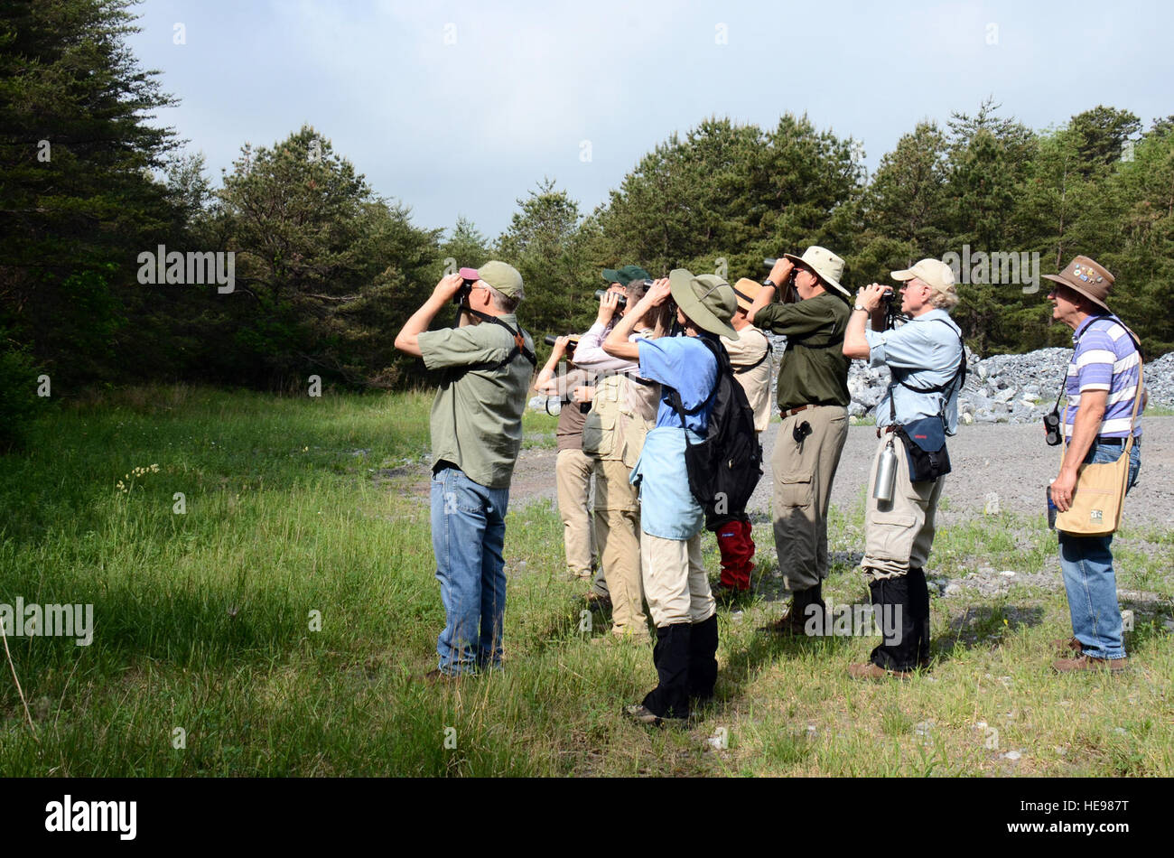 Birders take part in a bird walk led by the installation's wildlife staff, May 27, 2015. Fort Indiantown Gap currently provides habitat for 40 species of mammals, 249 species of birds, 36 species of reptiles and amphibians, 27 species of fish and many notable species of invertebrates including 83 species of butterflies and 241 species of moths. This includes excellent populations of deer, turkey, bear, bobcat, rabbit, squirrel, wild trout, amphibians, reptiles, small mammals and songbirds. The installation covers more than 17,000 acres, including approximately 1,000 acres of scrub oak and pitc Stock Photo