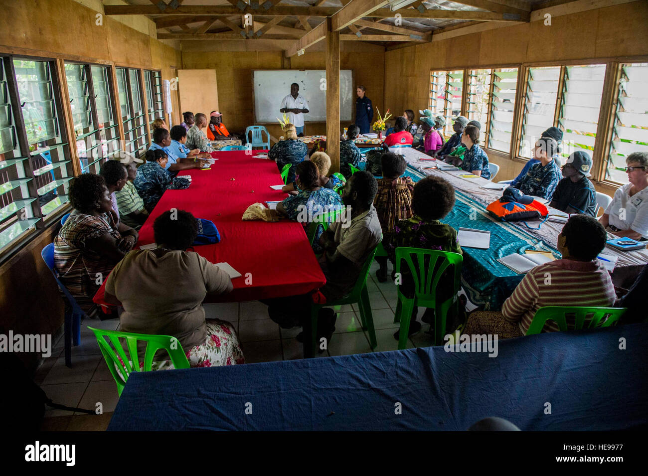 ARAWA, Autonomous Region of Bougainville, Papua New Guinea (July 2, 2015) Sam Kauona, a Bougainville politician, and Royal New Zealand Air Force Wing Cmdr. Jennifer Atkinson, Pacific Partnership 2015 chief of staff, give a presentation during a family violence prevention workshop at the Tuniva Learning Center. Kauona hosted the event with leaders from Bougainville and the hospital ship USNS Mercy (T-AH 19) to discuss how to prevent domestic abuse as part of the National Action Plan on Women, Peace and Security. Mercy is currently in Papua New Guinea for its second mission port of PP15. Pacific Stock Photo