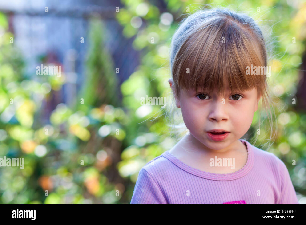 Portrait of little girl with surprised expression on face Stock Photo ...