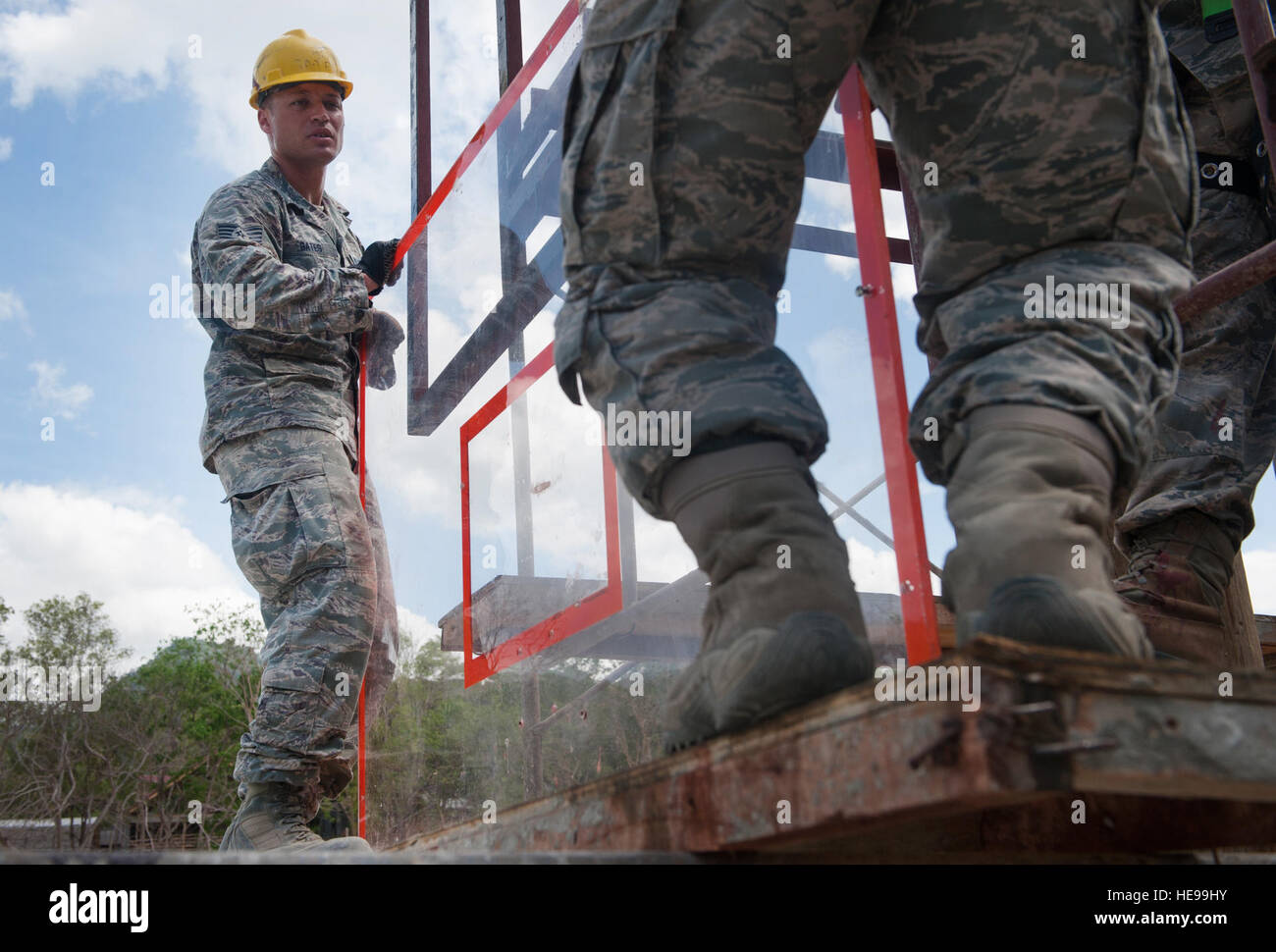 U.S. Air Force Staff Sgt. Corey Gates, 673rd Civil Engineer Group, a heating, ventilation, air conditioning craftsman, helps raise a backboard during construction a multipurpose basketball court during exercise Balikatan 2015, in San Rafael on the island of Palawan, Philippines, April 25. The construction of the basketball court was a part of an discretionary project that included excess materials and donations. This year marks the 31st iteration of the exercise, which is an annual Philippine-U.S. bilateral military training exercise and humanitarian civic assistance engagement.  Staff Sgt. Ch Stock Photo