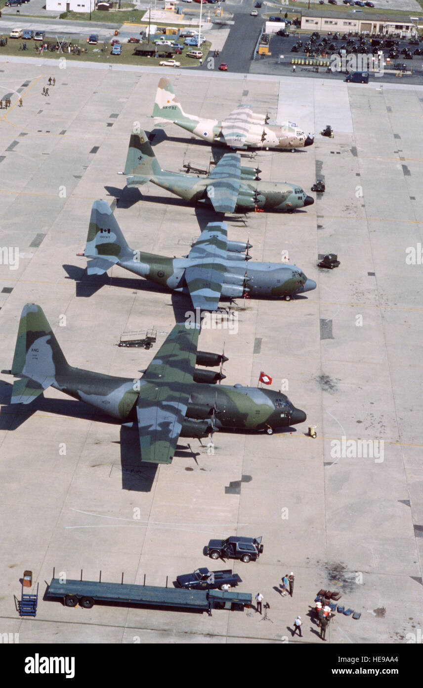 An aerial view of four C-130 Hercules aircraft, including three from ...