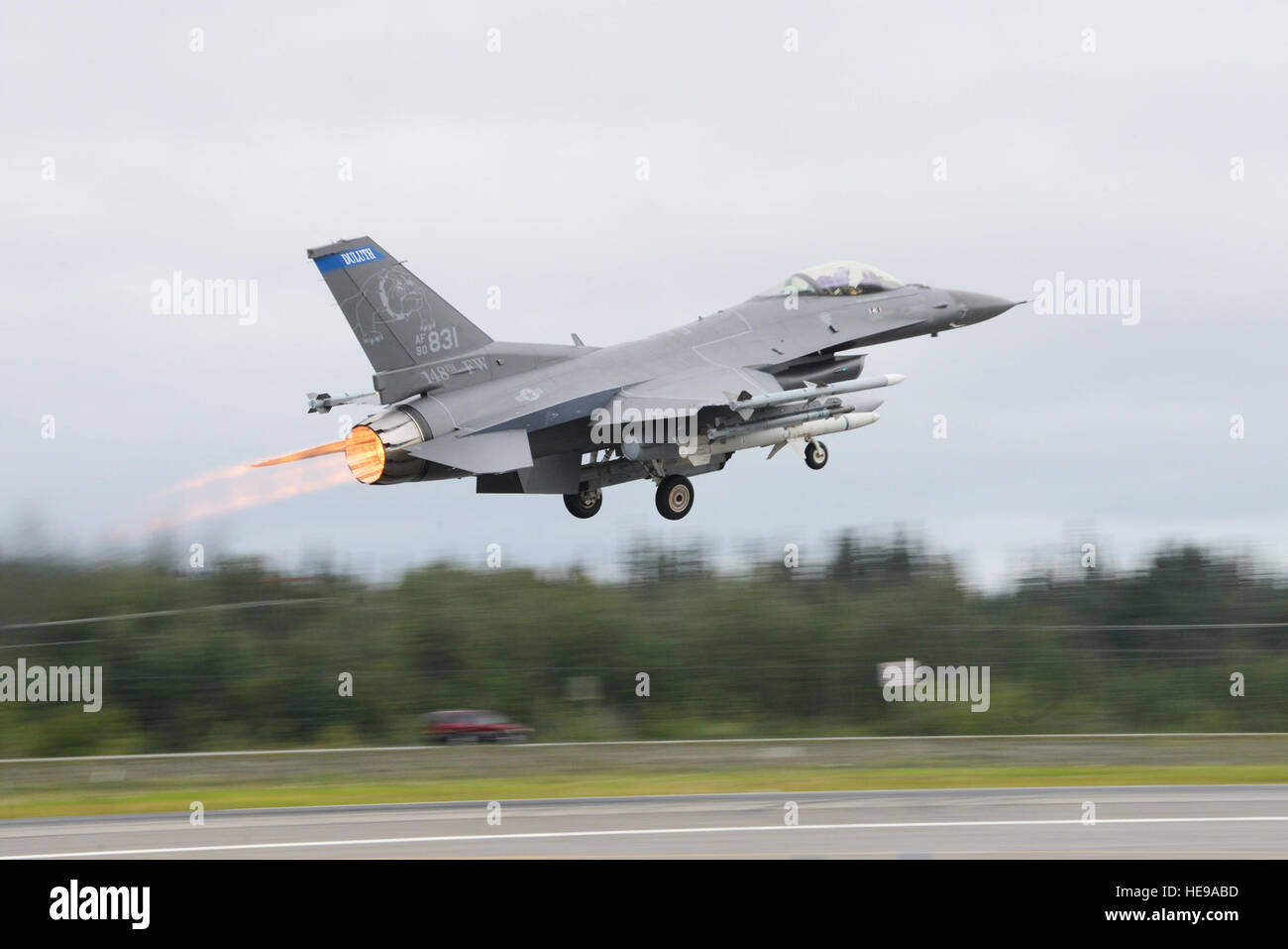 An F-16 Fighting Falcon assigned to the 179th Fighter Squadron at Duluth Air National Guard Base, Minn., takes off from Eielson Air Force Base, Alaska, Aug. 10, 2015, during Red Flag-Alaska 15-3. RF-A is a series of Pacific Air Forces field training exercises for U.S. and partner nation forces, providing combined offensive counter-air, interdiction, close air support and large force employment training in a simulated combat environment. Senior Airman Ashley Nicole Taylor) Stock Photo