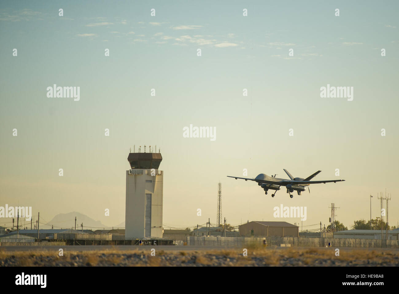 An MQ-9 Reaper equipped with Gorgon Stare from the 62nd Expeditionary Reconnaissance Squadron takes off at Kandahar Airfield, Afghanistan, Dec. 5, 2015. The capability combines real-time situational awareness for strike coordination and reconnaissance, or cross-cueing other sensors, with persistent video recording for forensic analysis and pattern-of-life study.  Tech. Sgt. Robert Cloys Stock Photo