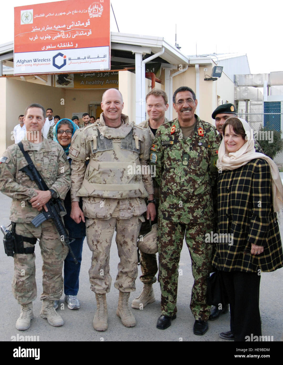 KANDAHAR, Afghanistan (Mar. 3 2014) Debrah Lyons, Canada's Ambassador to the Islamic Republic of Afghanistan, right, Maj Gen Dean Milner Commander of NATO Training Mission Afghanistan, center left, stand with senior coalition and Afghan medical personnel at Kandahar's Regional Military Hospital. Lyons and Milner were given a tour of the hospital and the capabilities they have for caring for the injured Afghan National Security Forces there. ( Tech. Sgt. Mark Bell Stock Photo