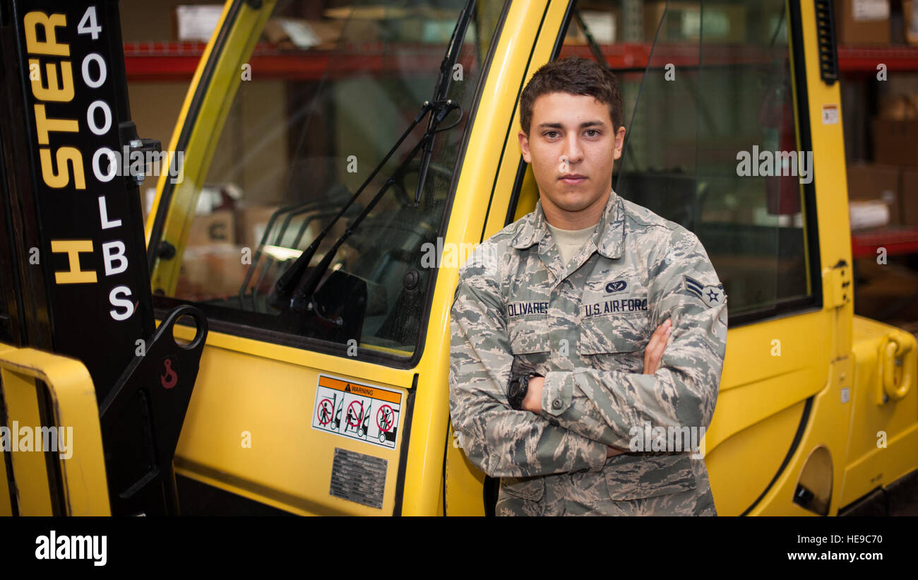 Airman 1st Class Jonathan Olivares, 49th Civil Engineer Squadron operations flight personnel, poses in front of a forklift that is regularly used while procuring and managing repair materials at Holloman Air Force Base, N.M., Sept. 26. Olivares and the operations flight personnel are the central hub to assist facility managers when repair items or emergencies arise. These airmen work to ensure the right equipment and supplies are ordered, stocked and available for any facility emergency.  Airman 1st Class Aaron Montoya / Released) Stock Photo