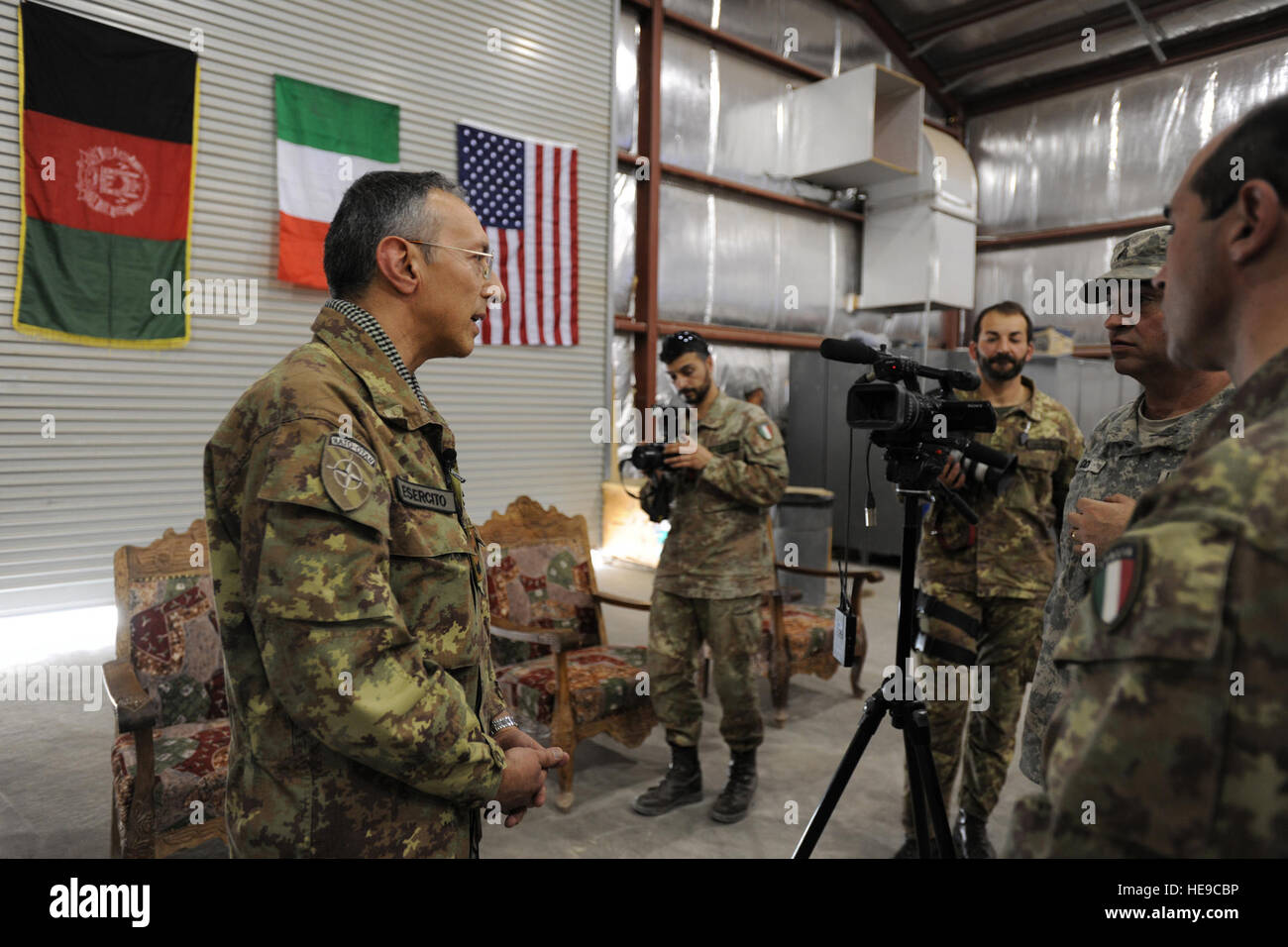 The Regional Command West (RC-West) Commander, Italian Brig. Gen. Alessandro Veltri, is interviewed by the Armed Forces Network (AFN) following the Change of Command Ceremony for the Farah Provincial Reconstruction Team (PRT), March 13, 2010, Forward Operating Base (FOB) Farah, Afghanistan. There are a total of four PRTs under Gen. Veltri’s command and the Farah PRT is the only American ran PRT in the Italian battle space. Stock Photo