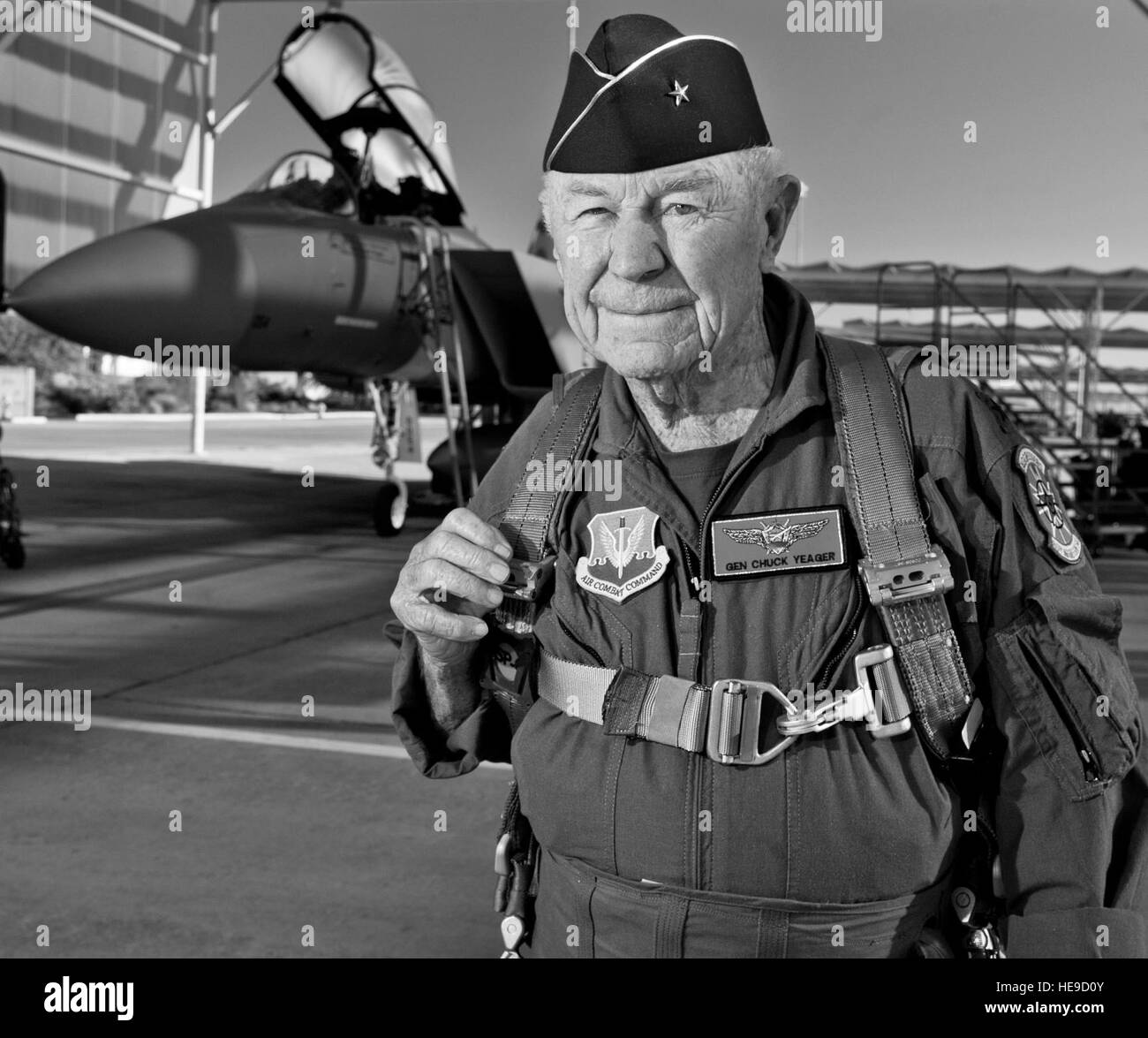 Retired United States Air Force Brig. Gen. Charles E. 'Chuck' Yeager prepares to board an F-15D Eagle from the 65th Aggressor Squadron, Oct. 14, 2012, at Nellis Air Force Base, Nev. In a jet piloted by Capt. David Vincent, 65th AGRS pilot, Yeager is commemorating the 65th anniversary of his historic breaking of the sound barrier flight, Oct. 14, 1947, in the Bell XS-1 rocket research plane named 'Glamorous Glennis.' Yeager was awarded the prestigious Collier Trophy in 1948 for this landmark aeronautical achievement. Stock Photo