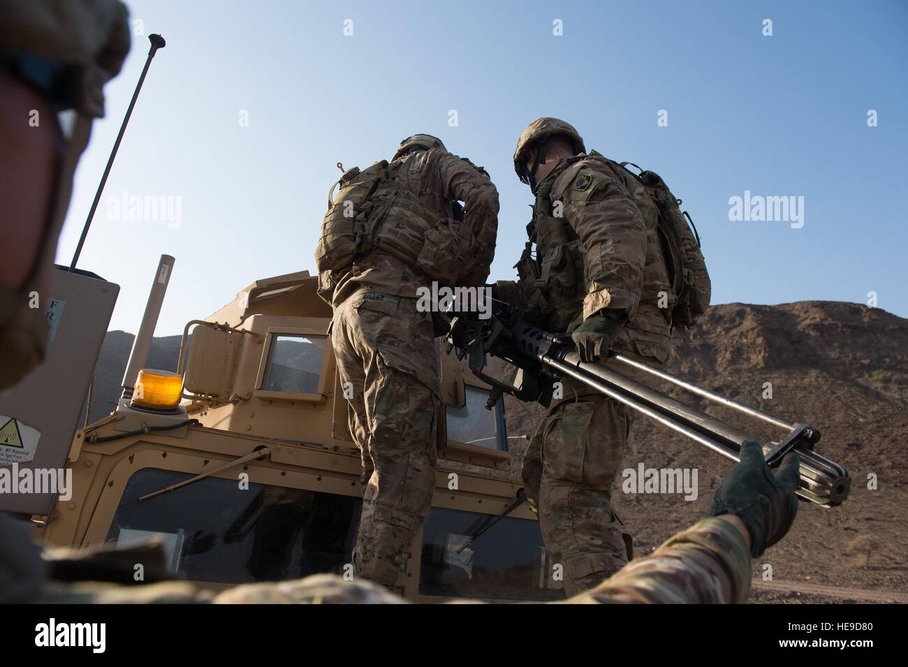 U.S. Soldiers assigned to Delta Company, 2nd Battalion, 124th Infantry Regiment, Combined Joint Task Force-Horn of Africa (CJTF-HOA), mount an M2A1 machine gun to a Humvee during a live-fire exercise in Arta, Djibouti, Jan. 8, 2016. Through unified action with U.S. and international partners in East Africa, CJTF-HOA conducts security force assistance, executes military engagement, provides force protection, and provides military support to regional counter-violent extremist organization operations in order to support aligned regional efforts, ensure regional access and freedom of movement, and Stock Photo