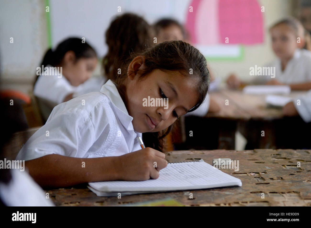 A Gabriela Mistral third grader practices math problems at the Gabriela