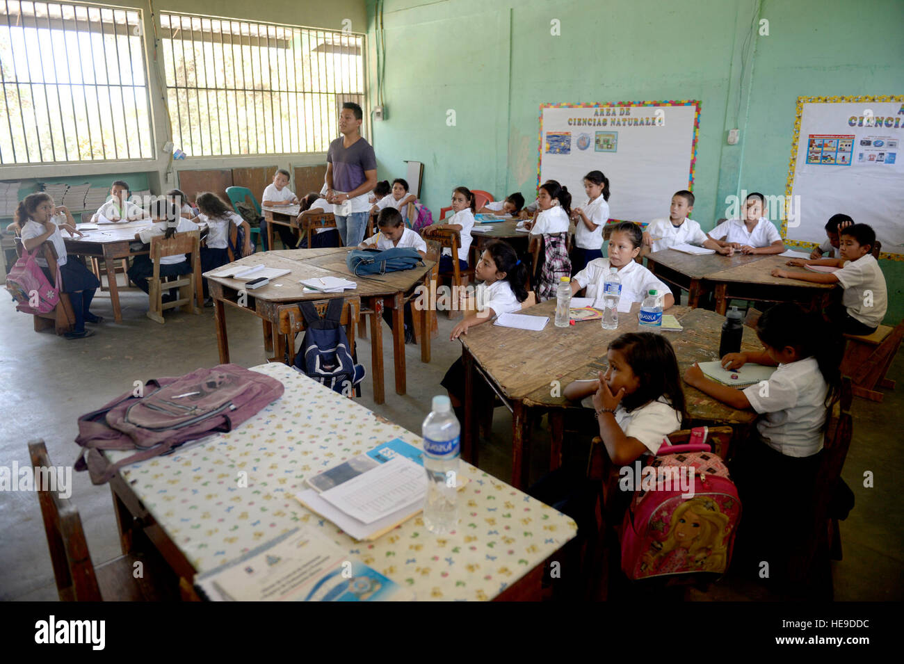 Cristian Suazo teaches Gabriela Mistral third graders math at the Gabriela Mistral school in Ocotes Alto, Honduras, June 16, 2015. Gabriela Mistral is the site of a new two-room classroom being built by U.S. Air Force Airmen from the 823rd Expeditionary RED HORSE Squadron, out of Hurlburt Field, Fla., and U.S. Marines from the 271st Marine Wing Support Squadron, 2nd Marine Air Wing, based out of Marine Corps Air Station Cherry Point, N.C., as part of the New Horizons Honduras 2015 training exercise going on throughout the Trujillo and Tocoa, Honduras regions. New Horizons was launched in the 1 Stock Photo