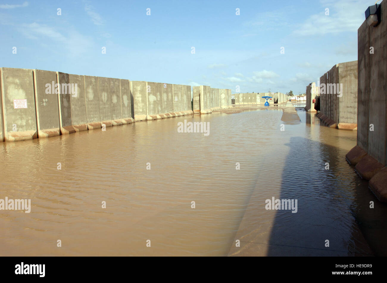 Water floods a housing area at Joint Base Balad, Iraq, Oct. 25. Because rain is infrequent in Iraq, when it does rain, the hardened ground soaks up little water. Tech. Sgt. Erik Gudmundson) Stock Photo