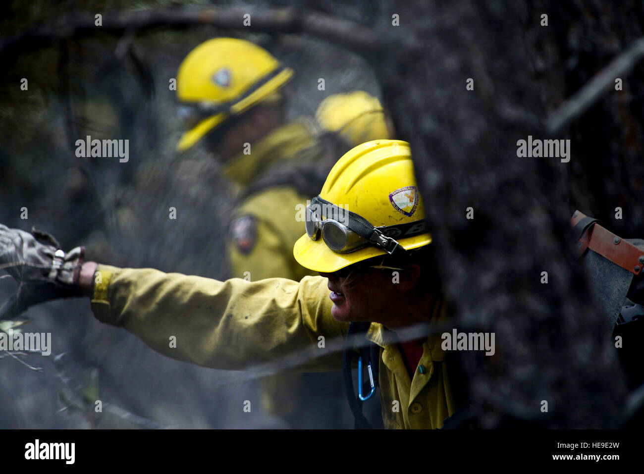 Vandenberg Air Force Base Hot Shot fire fighter Marissa Halbeisen helps cut and clear a fire line on June 28, 2012 in the Mount Saint Francois area of Colorado Springs, Co. while helping to battle several fires in Waldo Canyon.  The Waldo Canyon fire has grown to 18,500 acres and burned over 300 homes. Currently, more than 90 firefighters from the Academy, along with assets from Air Force Space Command; F.E. Warren Air Force Base, Wyo.; Fort Carson, Colo.; and the local community continue to fight the Waldo Canyon fire.(: Master Sgt. Jeremy Lock) (Released) Stock Photo
