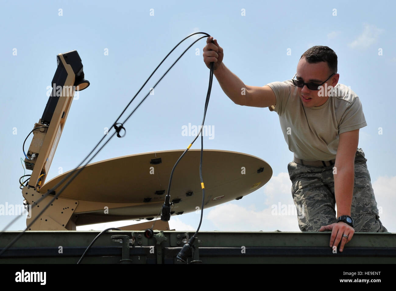 U.S. Air Force Staff Sgt. Matthew Vile, 36th Mobility Response Squadron cyber transport systems technician, sets up a satellite communications antenna at the Tribhuvan International Airport in Kathmandu, Nepal, May 6. The setup improved airfield radio range communications capabilities for the 36th CRG Airmen who are deployed to Nepal from Andersen Air Force Base, Guam, as part of Joint Task Force 505 participating in Operation Sahayogi Haat. The JTF is in Nepal to help the government and U.S. Agency for International Development with airfield operations and processing relief supplies after an  Stock Photo