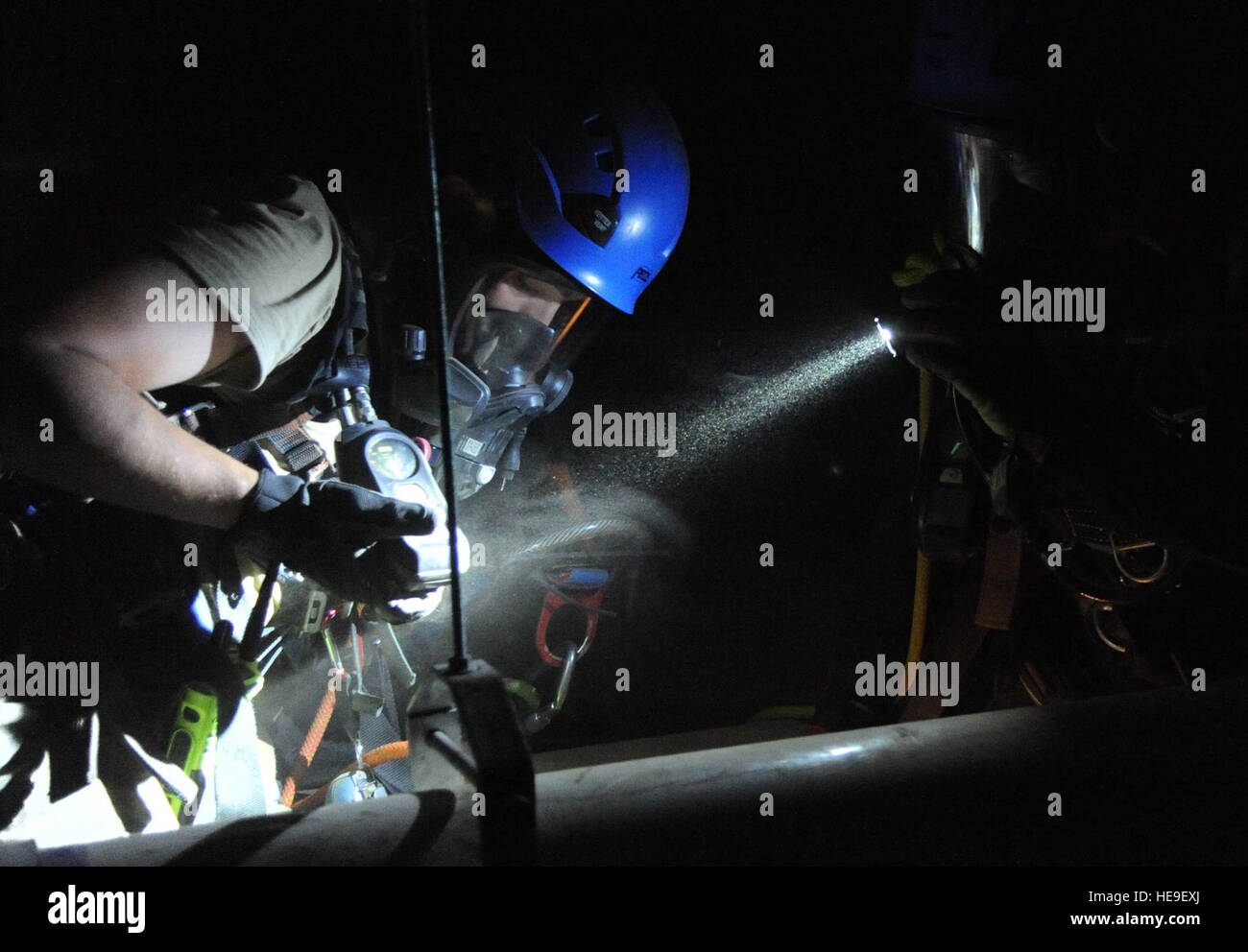 Senior Airman Aaron White, 81st Infrastructure Division firefighter, inspects his regulator air pressure level during confined space rescue operations training Feb. 13, 2015, at the medical center, Keesler Air Force Base, Miss. Keesler hosted the one-time advanced rescue certification training course, which consisted of confined space rescue, high and low angle rescue and stokes basket rescue operations. Eleven students from four bases completed the course.  Kemberly Groue Stock Photo