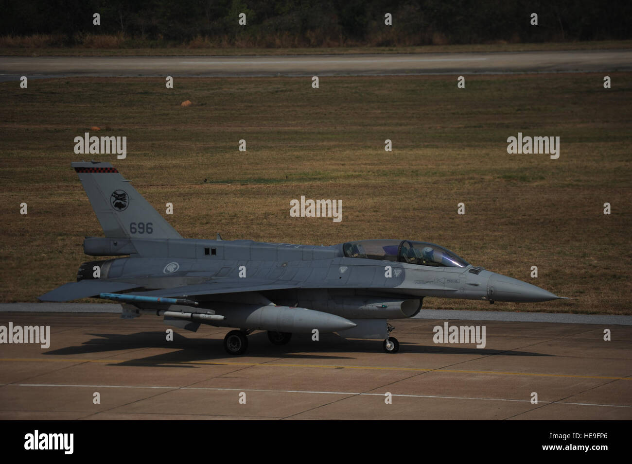 An F-16 Eagle prepares for flight operations during Cope Tiger 13 at Korat Royal Thai Air Force Base, Thailand, March 12, 2013.  More than 400 U.S. service members are participating in CT13, which offers an unparalleled opportunity to conduct a wide spectrum of large force employment air operations and strengthen military-to-military ties with two key partner nations, Thailand and Singapore. 2nd Lt. Jake Bailey) Stock Photo