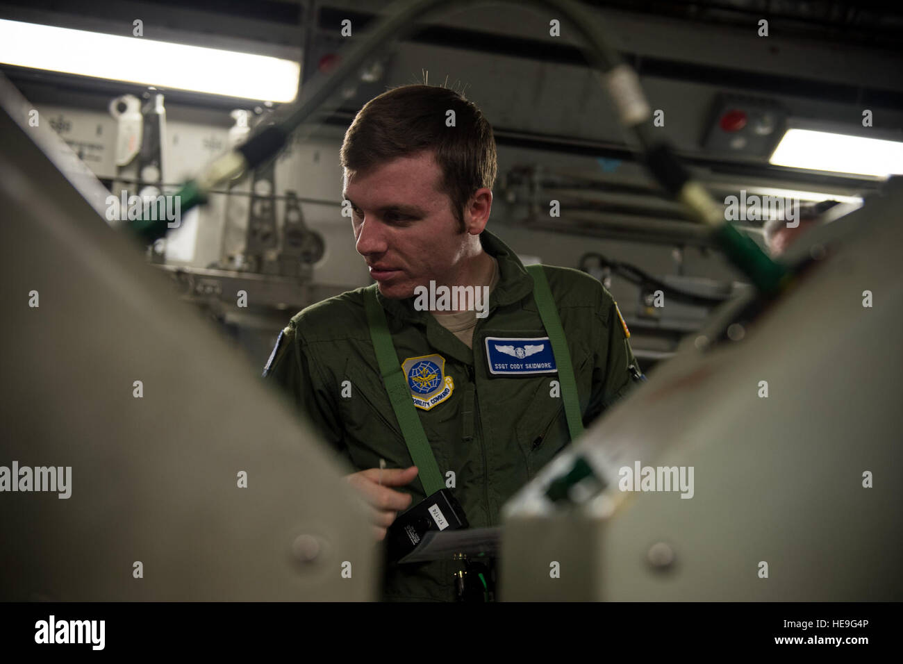 U.S. Air Force Cody Skidmore, a C-17 loadmaster with the 17th Airlift ...