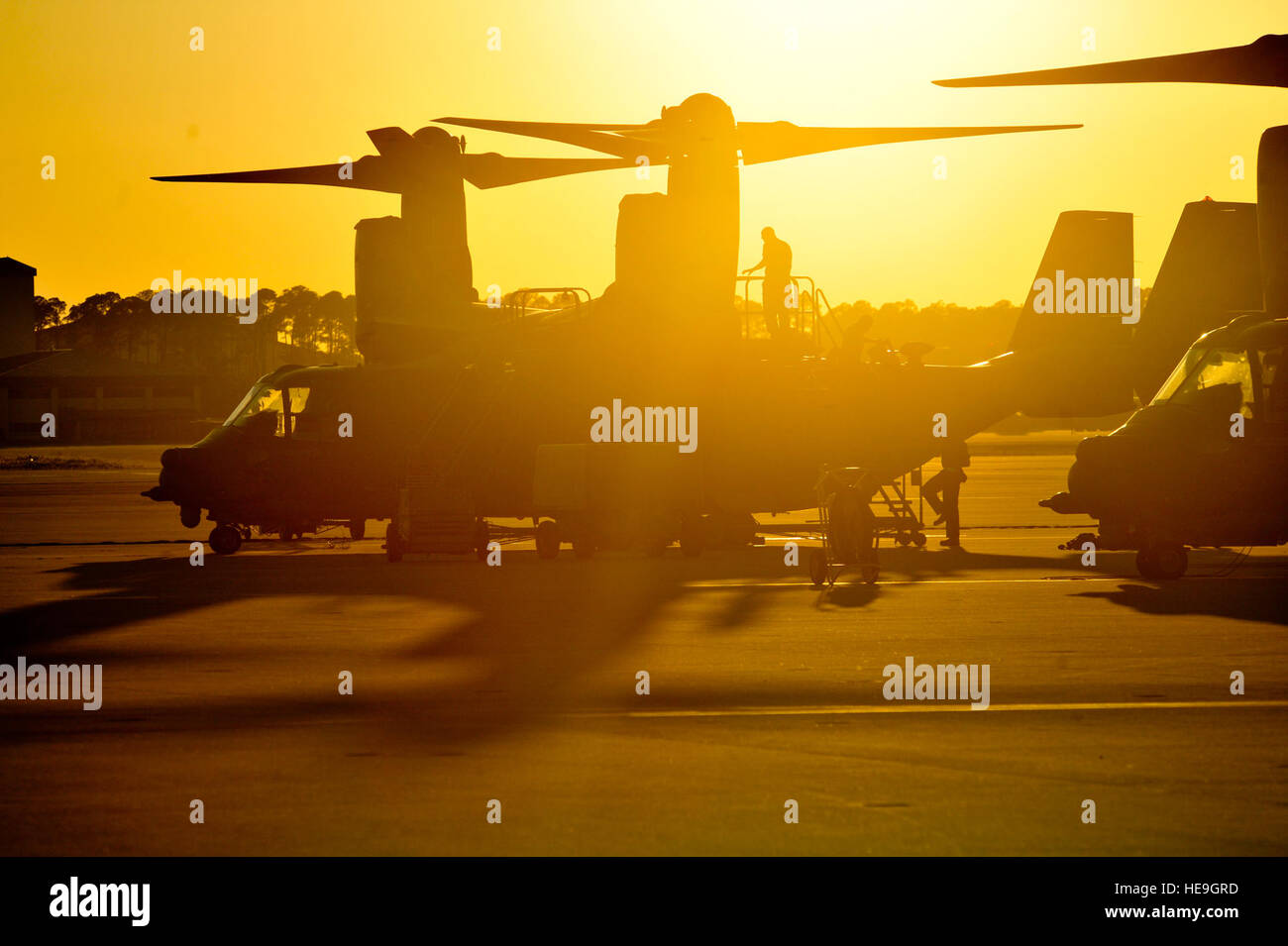 Airmen perform maintenance checks on a CV-22 Ospery during Emerald Warrior May 3, 2014, at Hurlburt Field, Fla. The CV-22s are flown during the annual, joint exercise to train special operations, conventional and partner nation forces in combat scenarios designed to hone special operations air-and-ground combat skills, and is the Defense Department’s only irregular warfare exercise.Staff Sgt. John Bainter) Stock Photo