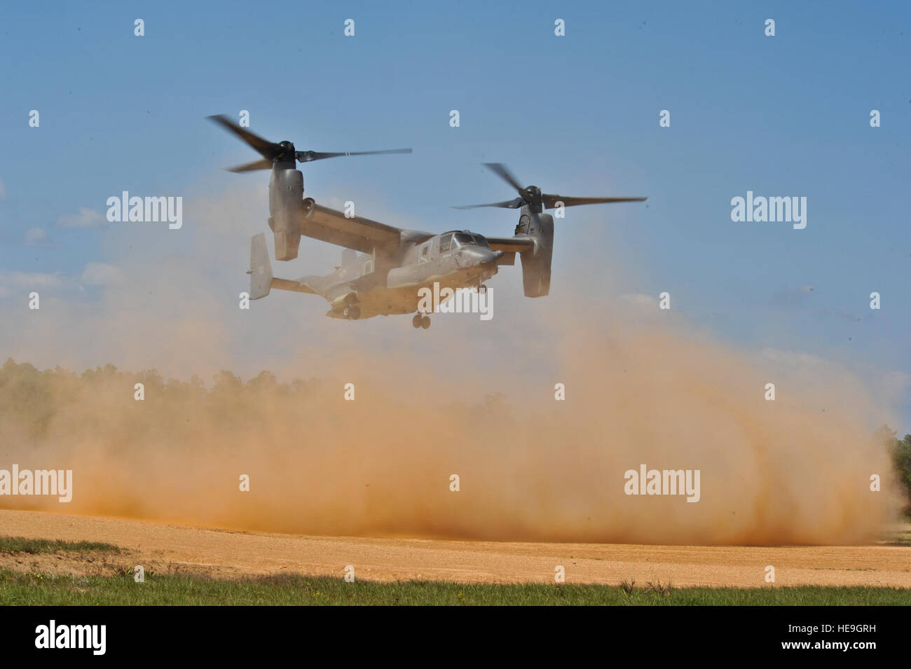 A U.S. Air Force CV-22 Osprey lands on  Eglin Range, Fla., May 21, 2014. The CV-22 is capable of functioning as a helicopter and can convert to a turboprop aircraft to accomplish high-speed forward flight.Staff Sgt. John Bainter) Stock Photo