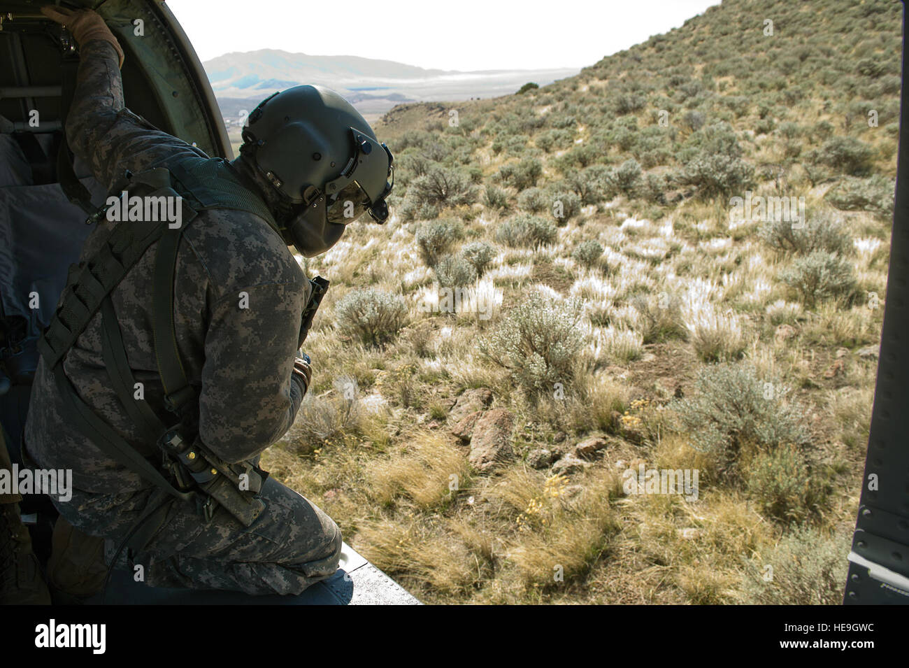 U.S. Army Sgt. Jason Townsen, a flight instructor from C Company 1-171 Medevac, Utah Army National Guard, West Jordan, Utah, participates in a search and rescue training exercise, a lost hiker, on Camp W.G. Williams, Riverton, Utah, on April 3, 2012. Stock Photo