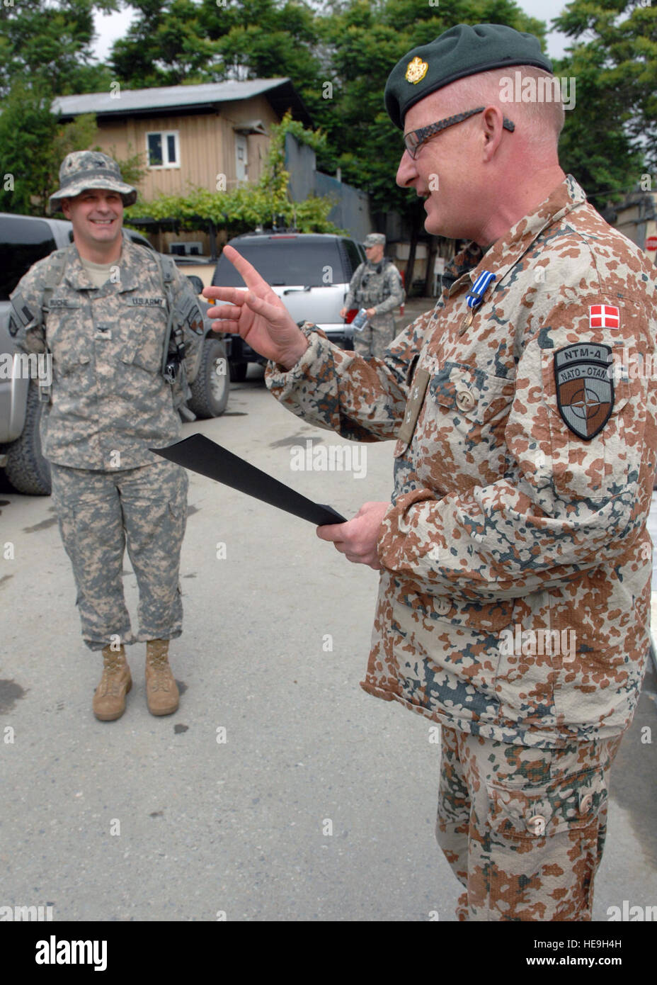 CAMP EGGERS, Afghanistan (May 4, 2010)--Danish Lt. Col Jens SUND accepts a NATO Achievement medal and certificate for his accomplishments while deployed and working for NATO Training Mission-Afghanistan.  Staff Sgt. Jeff Nevison) Stock Photo