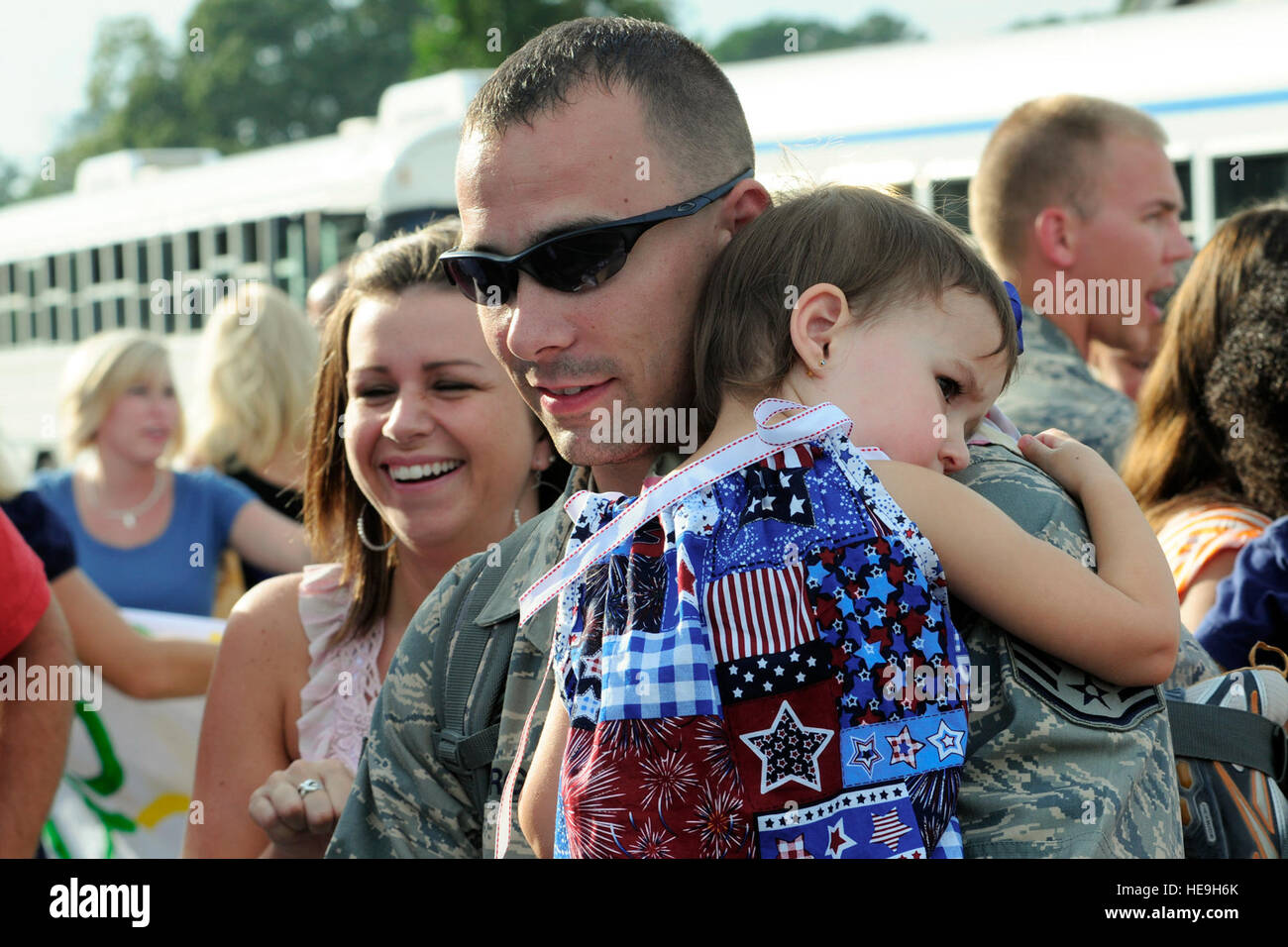 Family members of deployed 169th Fighter Wing Airmen, greet their airmen as they arrive to McEntire Joint National Guard Base, S.C., over 200 members of the 169th Fighter Wing return home Aug. 29, 2010, after a 120-day deployment to Iraq. The 169th Fighter Wing detachment was assigned to the 332nd Air Expeditionary Wing at Joint Base Balad, Iraq. While assigned to the 332nd AEW, the men and women of the 169th Fighter Wing generated and flew more than 800 combat air patrol missions over Iraq from May through August. Stock Photo