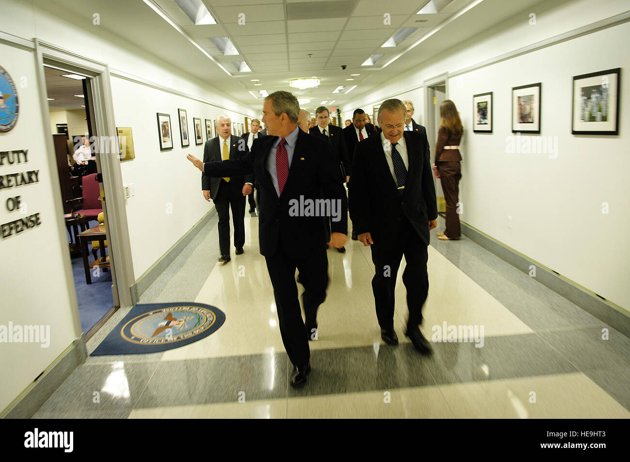 President George W. Bush greets DoD employees while heading to a ...