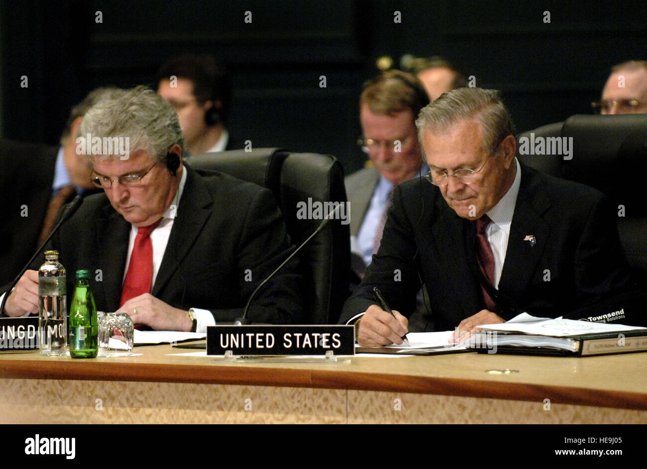 Minitser of Defense Des Browne (L) from the United Kingdom and Secretary of Defense Donald H. Rumsfeld listen to remarks during the NATO-Russia Council meeting, while at Portoroz, Slovenia, Sept. 29, 2006. Secretary Rumsfeld is visiting Slovenia to attend the NATO Defense Ministerial and conduct bilateral discussions with Slovenian leaders. Defense Dept.  James M. Bowman. (Released) Stock Photo