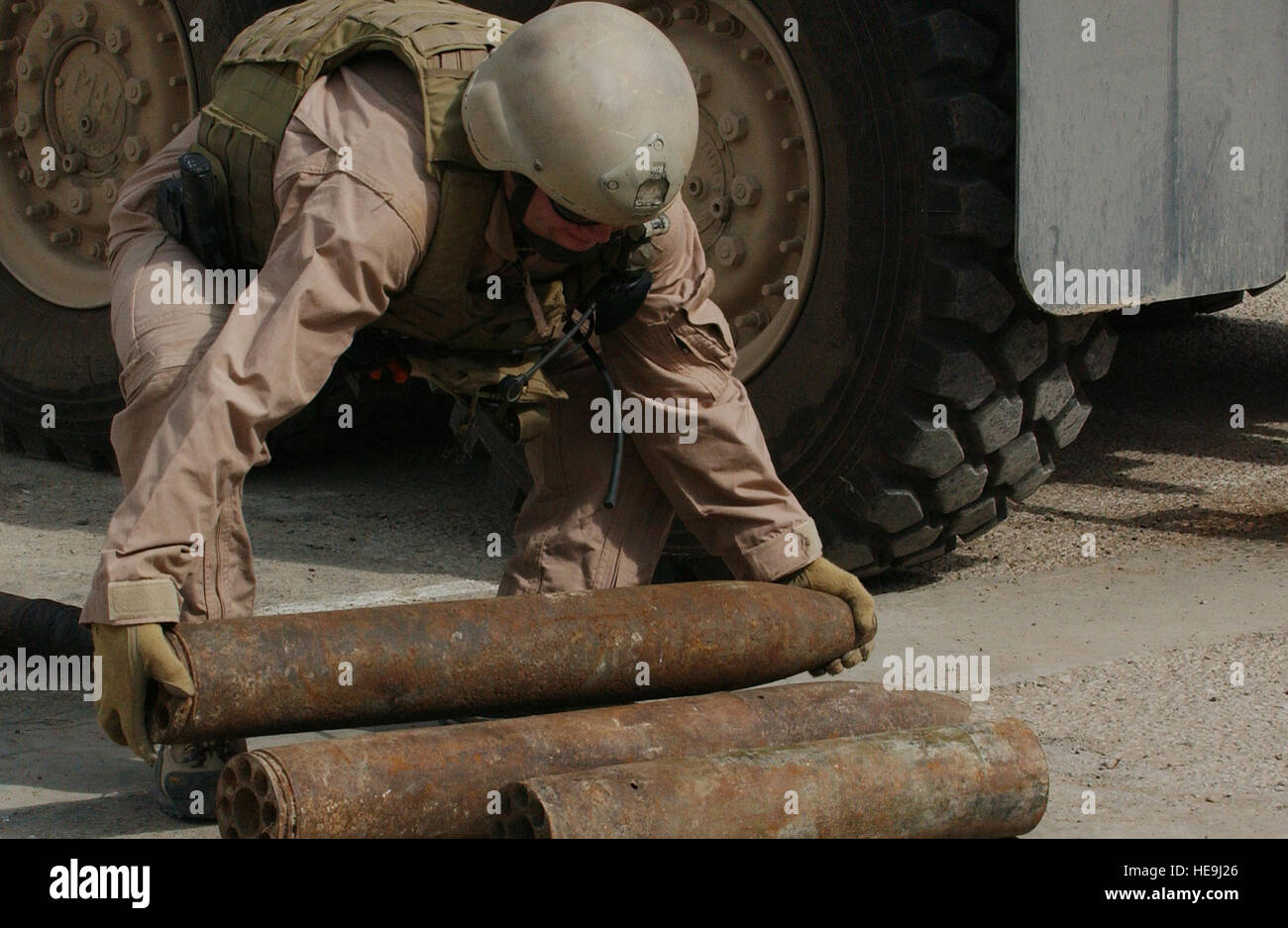 U.S. Navy Explosive Ordnance Technician 1st Class Donnie Walkey loads 107 mm rockets into the team vehicle at the Iraqi police headquarters in Ad Diwaniyah, Iraq, Oct. 30, 2006, for transport to Camp Echo, Iraq.  The U.S. Navy EOD Mobile Unit 3 responded to the Iraqi police headquarters to recover a cache of explosives found by policemen during a checkpoint vehicle search.  Walkey is from the U.S. Navy Explosive Ordnance Disposal Mobile Unit 3 Team, Multinational Division - Central South  Tech. Sgt. Dawn M. Price) (Released) Stock Photo