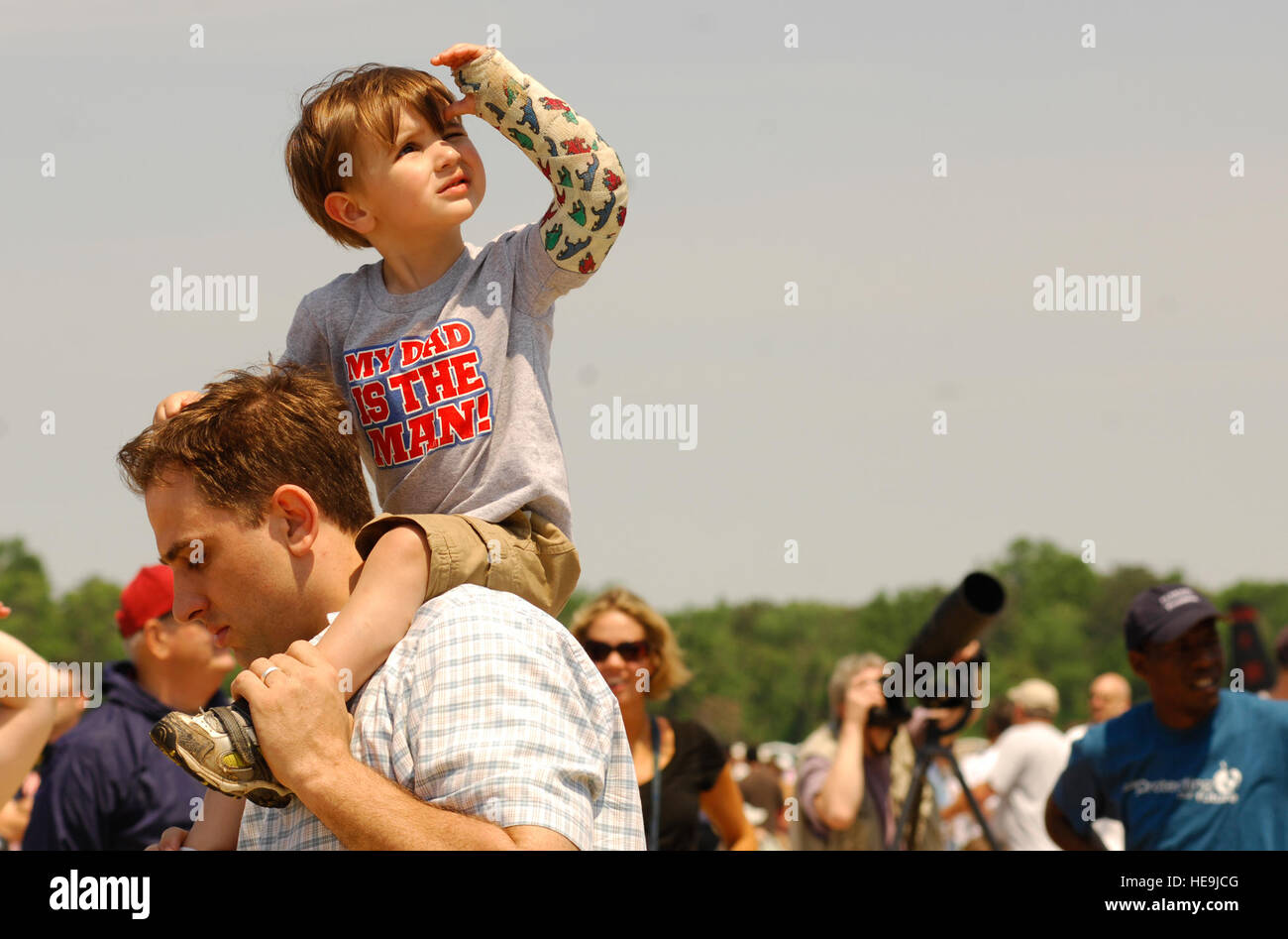 Logan Rearick Logan Rearick watches the sky for the F-22 Raptor, while his dad Jason ...