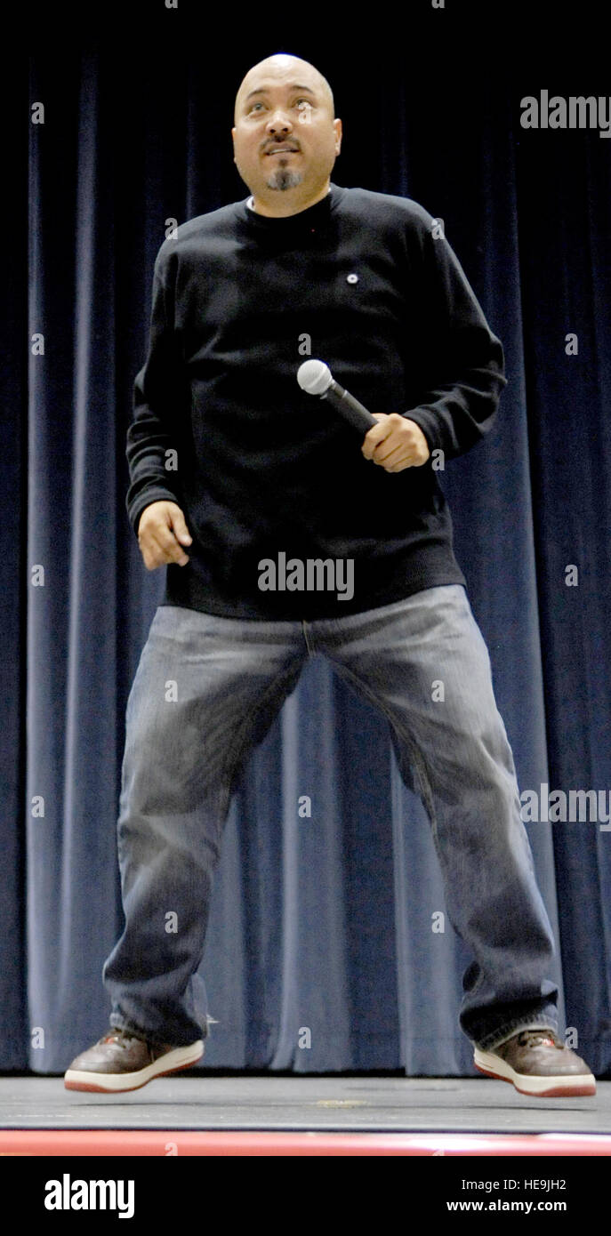 Comedian Edwin San Juan performs a joke about dancing during a visit to Kunsan Air Base, Korea, Nov. 12, 2008. San Juan is with a USO group traveling with Vice Chairman of the Joint Chiefs of Staff U.S. Marine Gen. James E. Cartwright.  Air Force Master Sgt. Adam M. Stump. (Released) Stock Photo