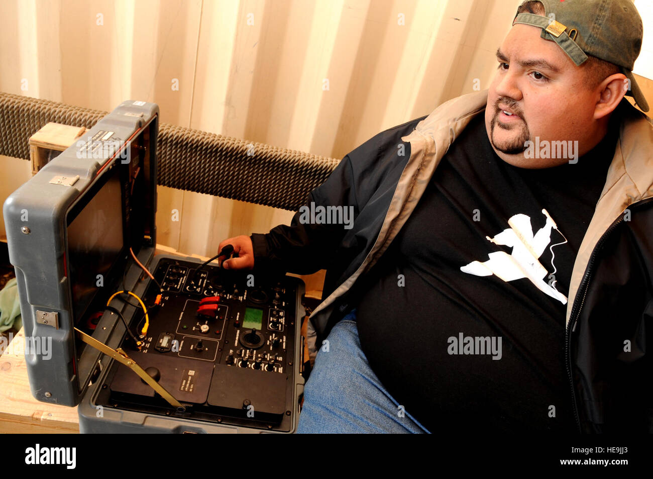 Comedian Gabriel Iglesias operates controls for a bomb disposal robot during a visit to Bagram Air Base, Afghanistan, Nov. 14, 2008. Iglesias is part of a USO group accompanying Vice Chairman of the Joint Chiefs of Staff U.S. Marine Gen. James E. Cartwright.  Air Force Master Sgt. Adam M. Stump. (Released) Stock Photo