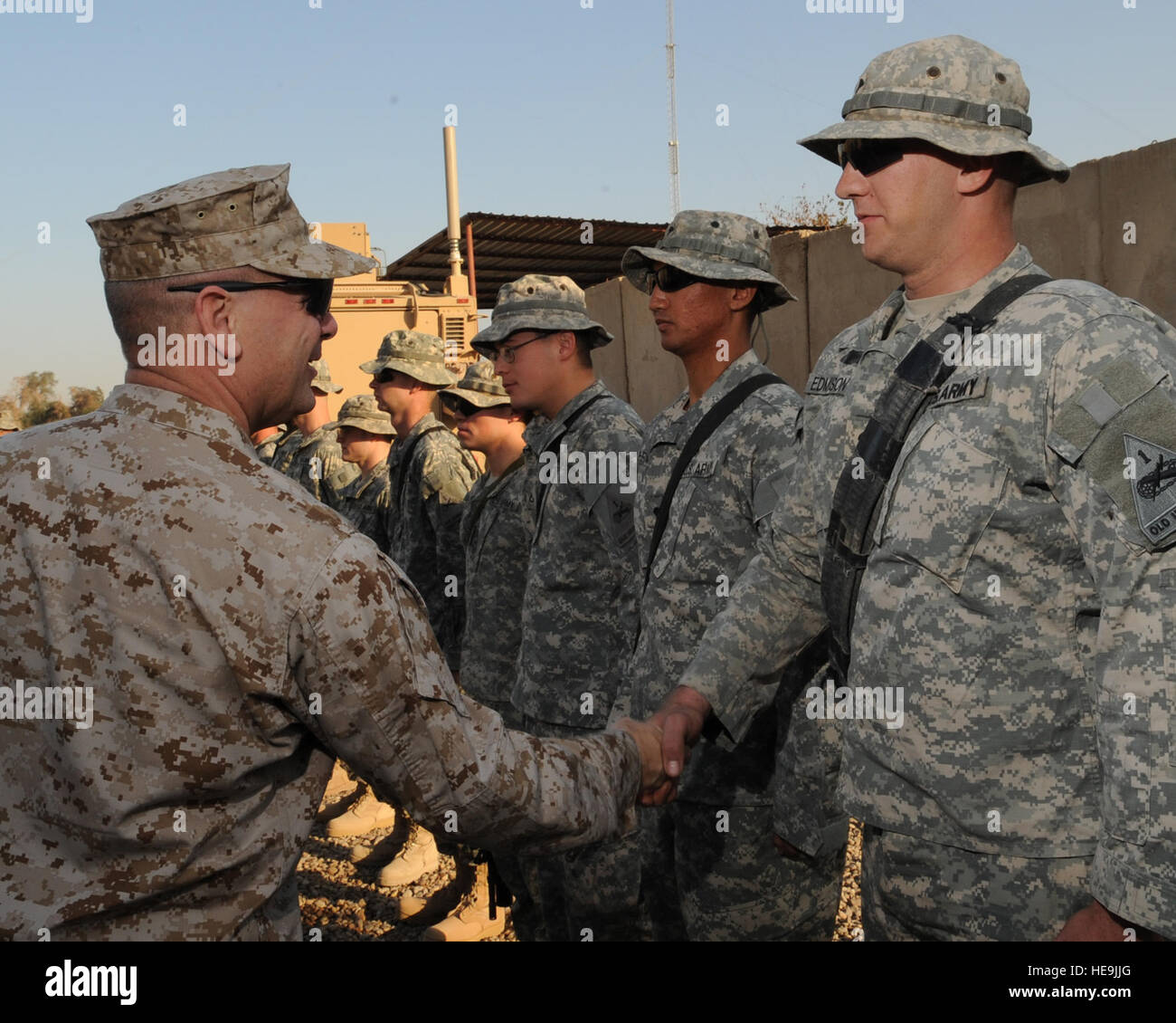 Military leaders visit Combat Outpost Cahill in Iraq, exchanging coins ...