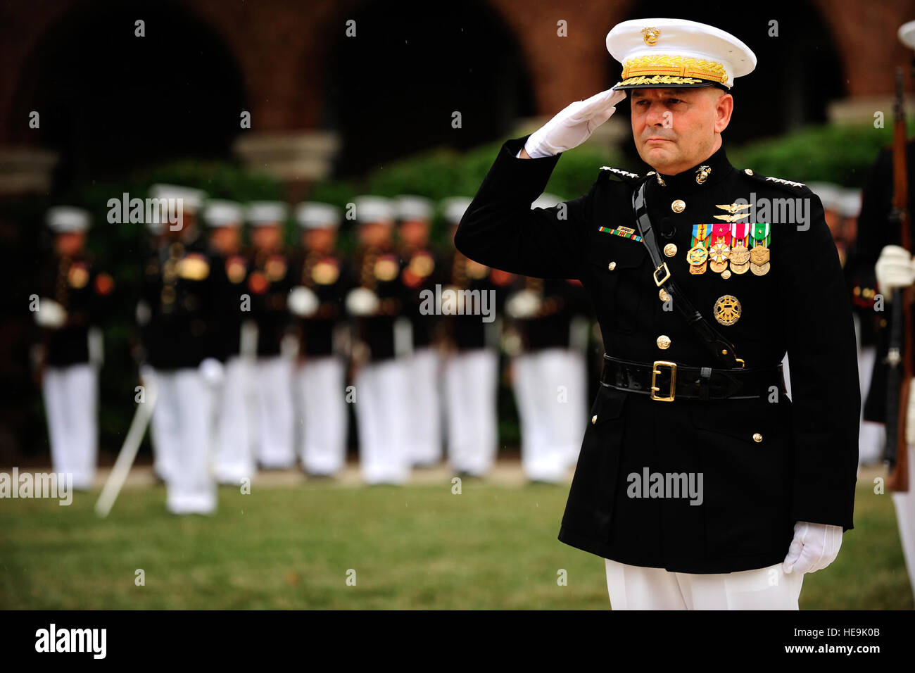 Joint Chiefs of Staff Vice Chairman Gen. James E. Cartwright salutes during the playing of the national anthem during a farewell ceremony in his honor at the Marine Corps Barracks, Washington, D.C., Aug. 3, 2011.  Tech. Sgt. Jacob N. Bailey, U.S. Air Force Stock Photo