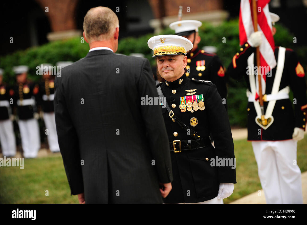 Deputy Secretary of Defense William J. Lynn prepares to award Joint Chiefs of Staff Vice Chairman Gen. James E. Cartwright the Defense Distinguished Service Medal at the Marine Corps Barracks, Washington, D.C., Aug. 3, 2011.  Tech. Sgt. Jacob N. Bailey, U.S. Air Force Stock Photo