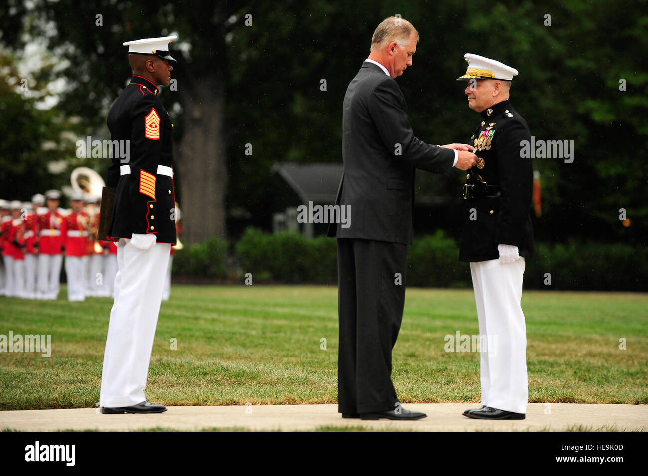 Deputy Secretary of Defense William J. Lynn awards Joint Chiefs of Staff Vice Chairman Gen. James E. Cartwright the Defense Distinguished Service Medal at the Marine Corps Barracks, Washington, D.C., Aug. 3, 2011.  Tech. Sgt. Jacob N. Bailey, U.S. Air Force Stock Photo