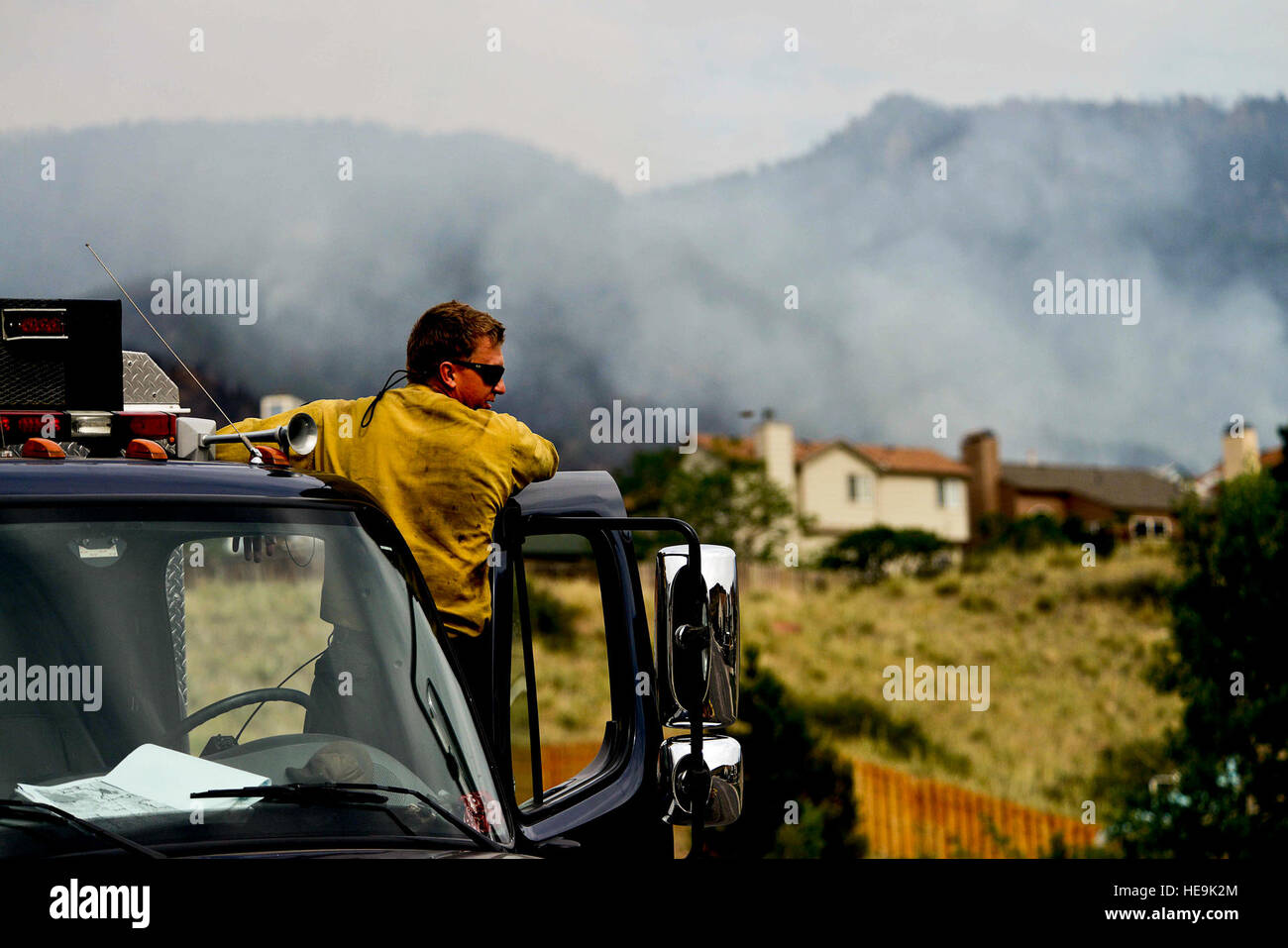 Vandenberg Air Force Base Hot Shot fire fighter Richard Strange looks out at his worksite for the day on June 28, 2012 in the Mount Saint Francois area of Colorado Springs, Co. His team will be cutting a fire line while helping to battle several fires in Waldo Canyon.  The Waldo Canyon fire has grown to 18,500 acres and burned over 300 homes. Currently, more than 90 firefighters from the Academy, along with assets from Air Force Space Command; F.E. Warren Air Force Base, Wyo.; Fort Carson, Colo.; and the local community continue to fight the Waldo Canyon fire.(: Master Sgt. Jeremy Lock) (Relea Stock Photo