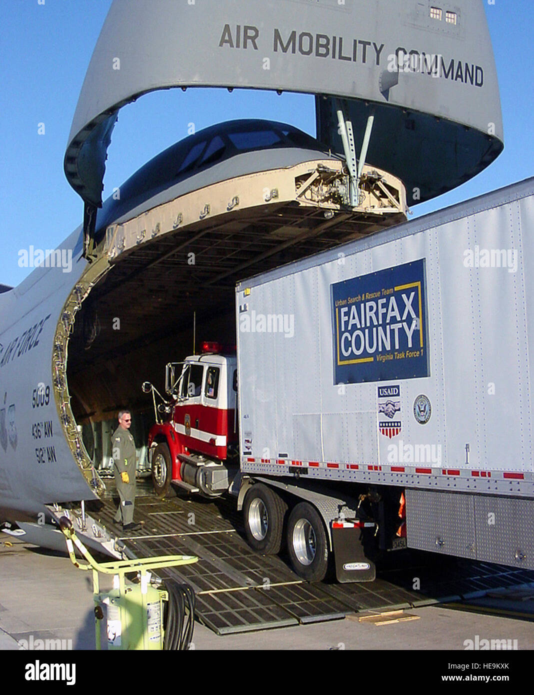 A tractortrailer from Virginia's Fairfax County Urban Search and Rescue Team loaded aboard a C