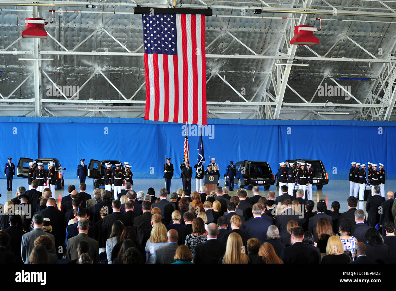 Joint Base Andrews hosts a dignified transfer ceremony Sept. 14 for U.S. Foreign Service members killed during attacks on the U.S. consulate Sept. 11, 2012, in Benghazi, Libya. President of the U.S. Barack Obama and Secretary of State Hillary Rodham Clinton both shared remarks remembering U.S. Ambassador J. Christopher Stevens and State Department members Sean P. Smith, Glen A. Doherty and Tyrone S. Woods.  Senior Airman Steele C. G. Britton) Stock Photo