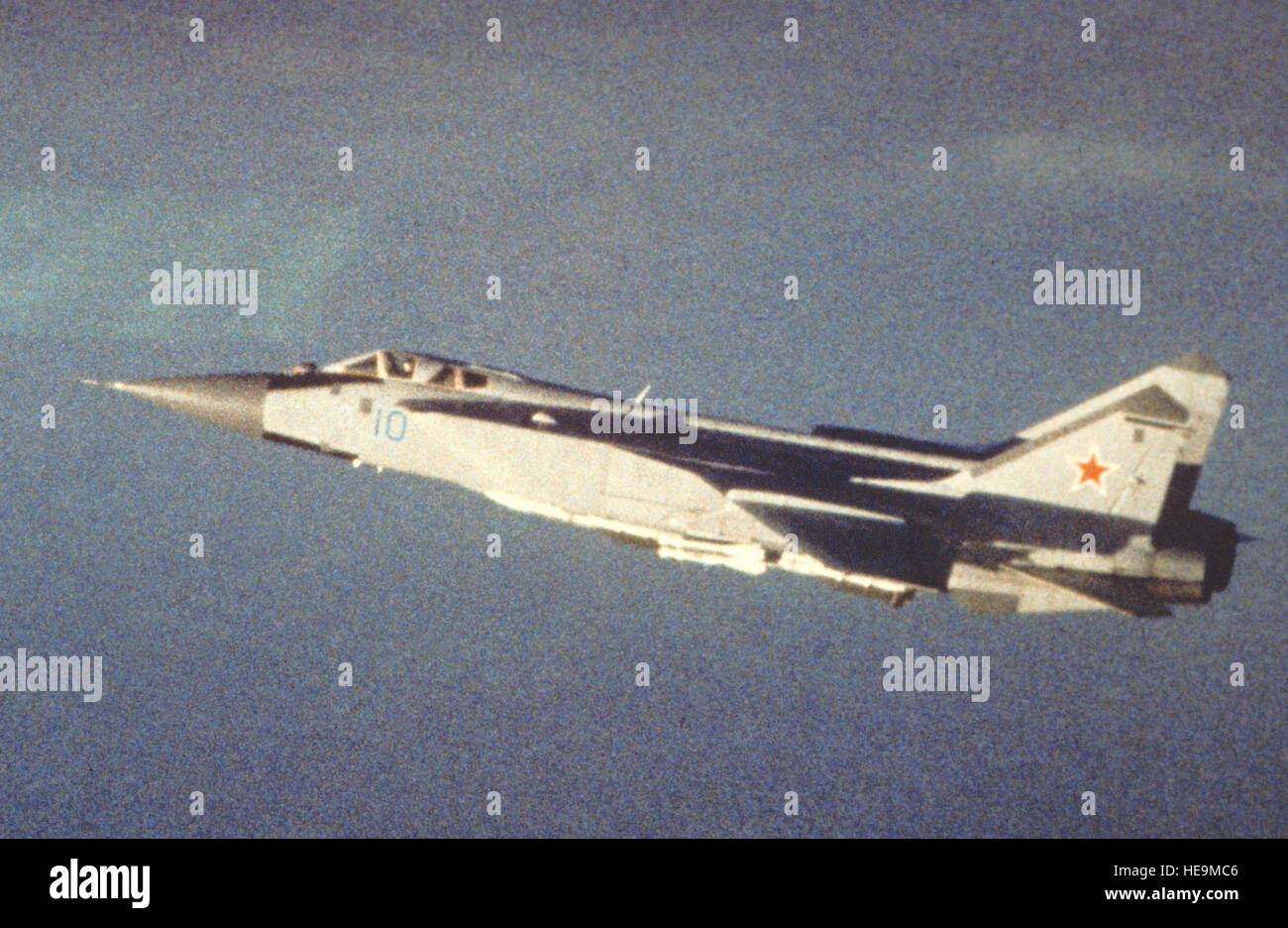 An air-to-air left side view of a Soviet MiG-31 Foxhound aircraft. Exact Date Shot Unknown Stock Photo