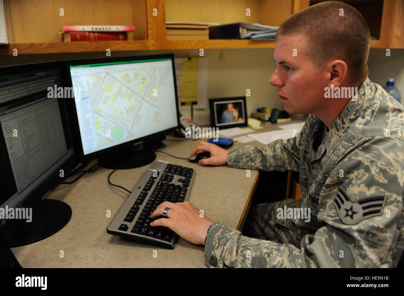 Senior Airman Brandon Stubblefield 5th Civil Engineering Squadron engineering technician, works on a map using Geographic Information System software at Minot Air Force Base, N.D., June 5. Stubblefield is a member of the drafting shop which is in charge of plotting all base structures in addition to power grids, water lines and base landmarks. Stock Photo